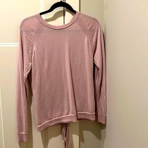 Women’s Lululemon sweater with tie up back. Soft pink color size 8.